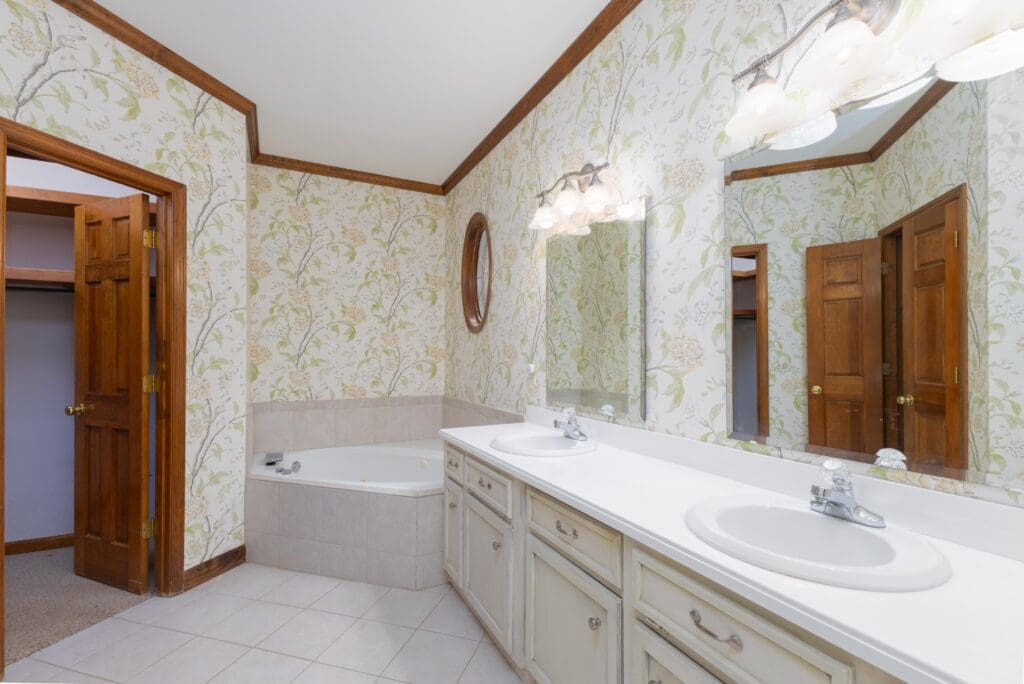 Primary bathroom in Ashley Hills Lexington SC with double vanity, soaking tub, and walk-in shower